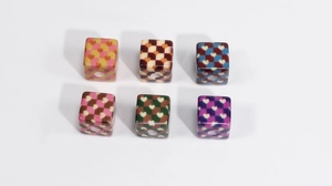 Detail view of colorful checkered acrylic cube beads with heart patterns for DIY jewelry