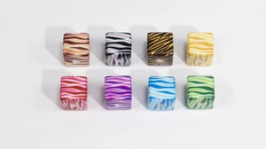 Close-up of colorful acrylic square beads with leopard zebra prints for DIY jewelry making
