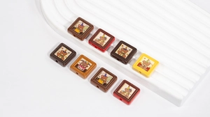 Close-up of square DIY beads with cartoon party bears for handmade jewelry crafts