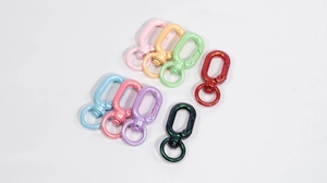 Close-up of matte colorful spring gate hooks with 360-degree swivel rings for keychains
