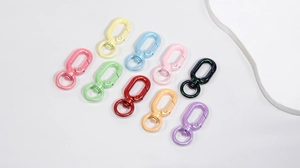 Flat lay of colorful glitter-finish swivel lobster clasps for DIY jewelry and keychain