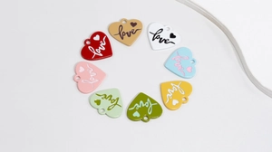 Set of 9 colorful heart-shaped enamel charms with Love engraving and hanging loops