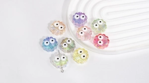 Macro shot of colorful acrylic flower beads with cartoon eyes for DIY jewelry making