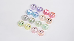 Macro shot of colorful acrylic flower beads with cartoon eyes for DIY jewelry making