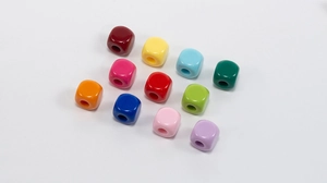 Top view of colorful acrylic square beads with round holes for DIY jewelry making