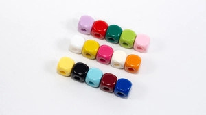 Macro shot of colorful square acrylic beads with large holes for DIY jewelry making
