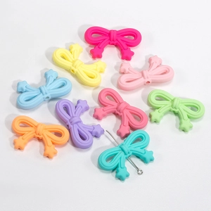 Colorful acrylic bow beads in macaron shades for DIY jewelry and phone charms making