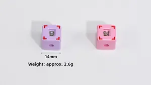 Macro view of 14mm acrylic mahjong beads in purple and pink for DIY jewelry making