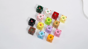 Close-up of colorful acrylic square beads with Chinese lucky characters for DIY jewelry