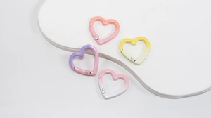 Set of four heart-shaped spring ring carabiners with pastel gradient finish for bag accessories