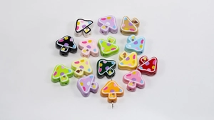 Close-up of colorful mushroom beads with polka dots and small window details for DIY jewelry