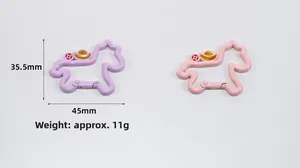 Detailed view of colorful unicorn-shaped metal keychains with Chinese fortune coins