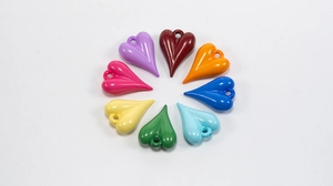 Macro view of colorful heart-shaped leopard print pendants in a circular arrangement