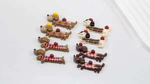 Macro detail of acrylic cartoon dachshund beads with side holes for DIY jewelry making