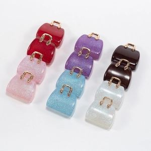 Colorful acrylic handbag charms with glitter filling and golden handles for DIY crafts