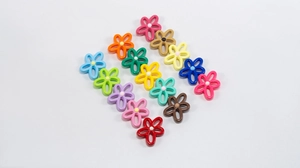 Macro view of colorful hollow flower beads with central core for DIY jewelry making
