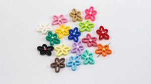 Macro shot of colorful hollow flower resin beads for DIY jewelry and necklaces