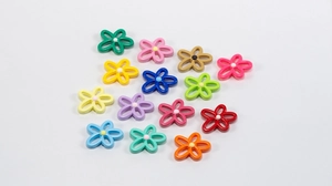 Detail showing 14 colorful hollow flower beads for DIY jewelry and necklace crafts