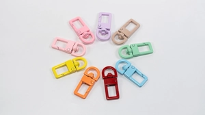 Close-up of colorful matte metal square lobster clasps for DIY jewelry making and crafts