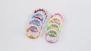 Close-up of colorful polka dot spring rings for DIY keychains and accessory linking