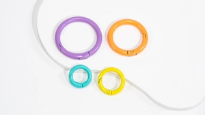 Macro detail of colorful matte round spring ring buckles in various sizes and vibrant colors