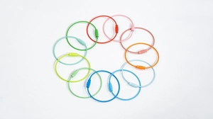 Detailed top view of twelve colorful coated steel wire keychains with screw connectors