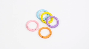 Macro shot of colorful round spring ring clasps in five macaron shades for DIY keychains