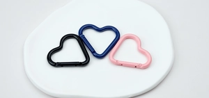 Three-piece set of heart-shaped spring rings in black, navy blue, and pink for DIY crafts