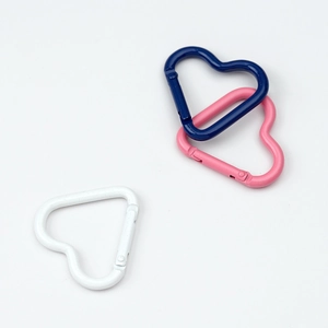 Colorful heart-shaped spring ring carabiners in white, pink, and navy blue alloy metal