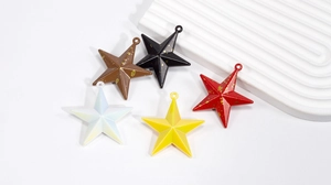 Close-up of colorful pentagram star charms for DIY crafts and jewelry making projects