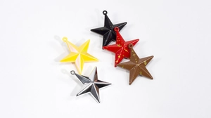 Close-up of five-pointed star charms in colorful finishes for DIY jewelry making