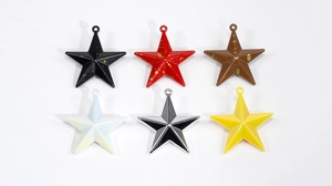 Macro view of assorted colorful star charms with glitter for DIY jewelry making