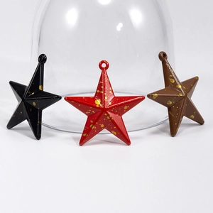 Star-shaped pendant accessories with gold splatter texture in black, red, and brown tones