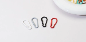 Close-up of assorted colorful alloy carabiner clips in red, black, grey and white