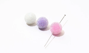 Macro view of textured jelly beads with through-holes for DIY jewelry making