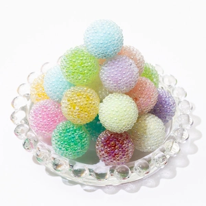 Colorful macaron sugar beads in a glass tray for DIY jewelry and phone chain making