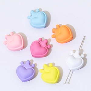 Macro shot of colorful heart-shaped crown silicone beads for DIY jewelry making