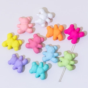 Macro detail of colorful geometric faceted bear beads for DIY jewelry and phone chains