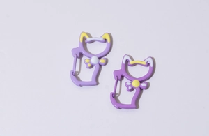 Detail of purple cat-shaped metal spring carabiners with painted enamel finish for DIY