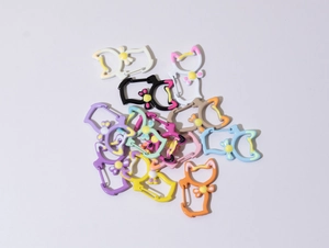 Cat-shaped spring carabiner hooks in assorted macaron colors with flower charms