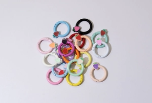 Colorful strawberry spring ring buckles in various matte lacquer finishes for DIY projects