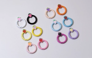 Macro detail of colorful strawberry spring ring clasps for DIY jewelry making