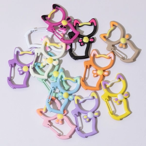 Colorful cat-shaped carabiner keyrings with bow tie design in multiple vibrant paint colors