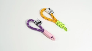 Macro detail of hand-woven nylon lanyards with vibrant contrast stitching and brand labels