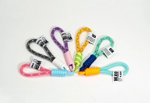 Macro view of multi-colored hand-woven keychain straps with contrast wrap detailing