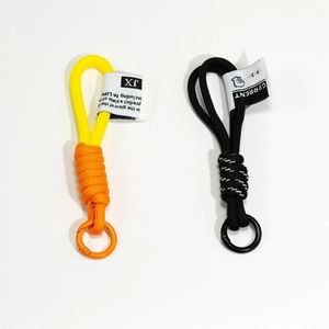 Handmade braided nylon paracord keychain in yellow-orange and black with metal spring ring