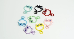 Close-up of colorful alloy spring rings with evil eye beads for DIY keychains