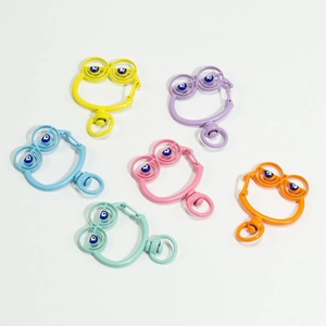 Colorful frog spring ring keychains with evil eye bead detail and rotating alloy hooks