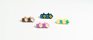 Macro shot of 2024 number charms in diverse colors for DIY keychain making projects