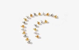 Close-up of 18K gold and silver plated round bead clasps for jewelry making projects